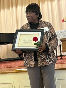 Photo of 2024 Named Gift Honoree, Shelia Bullock with certificate.